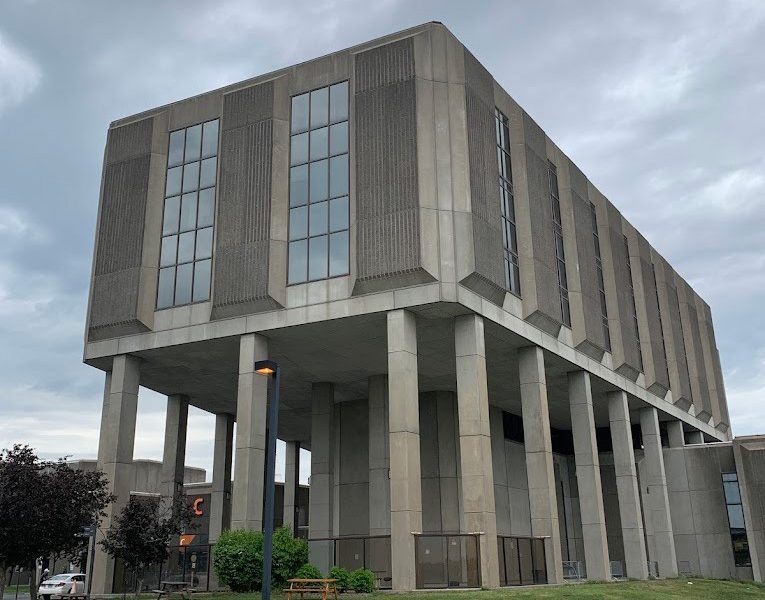 Main building of Cité-de-la-Santé hospital in Laval, brutalist architecture with massive columns