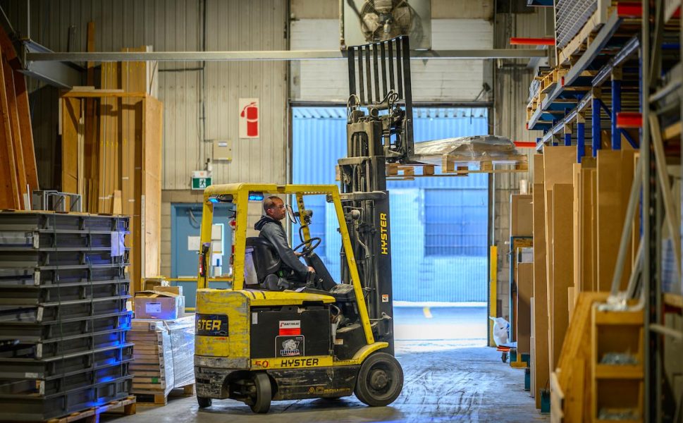 Forklift operator handling pallets inside the Portes Saint-Michel warehouse
