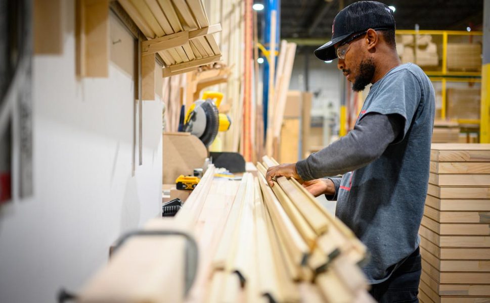 Portes Saint-Michel worker assembling wood for interior door manufacturing